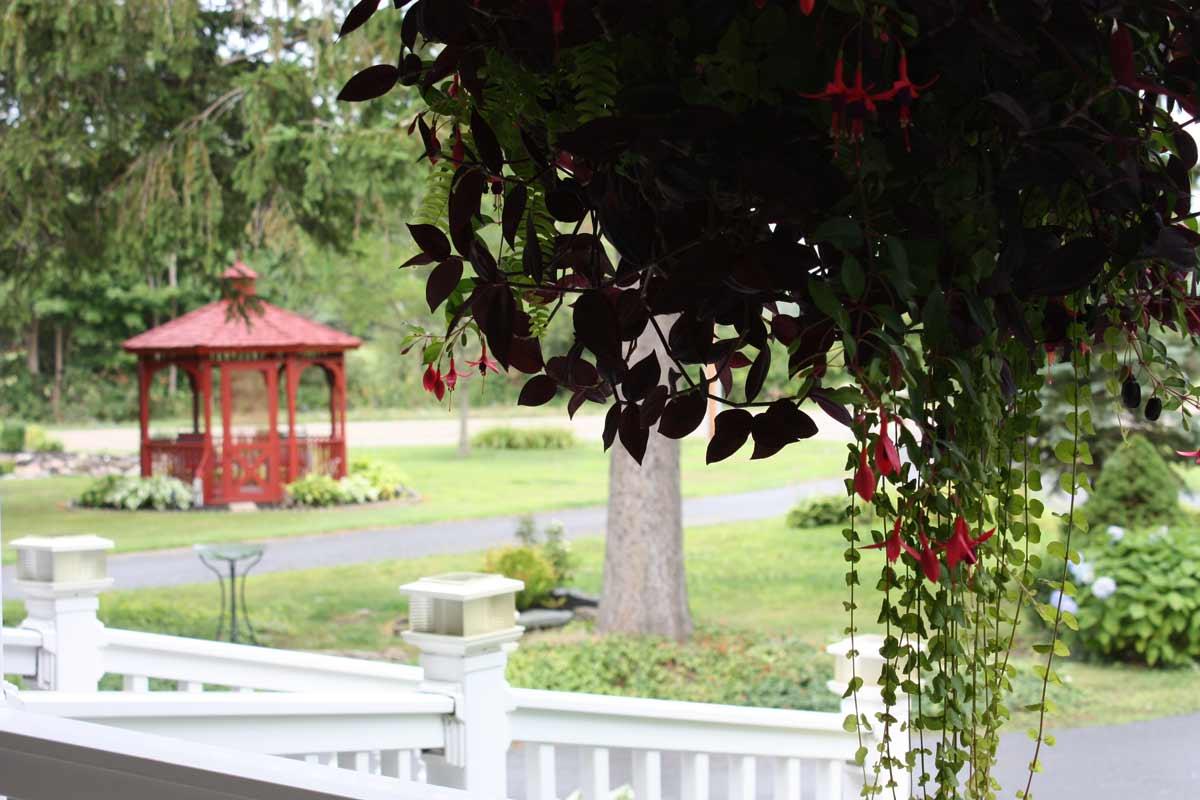 red gazebo from the view of the front porch